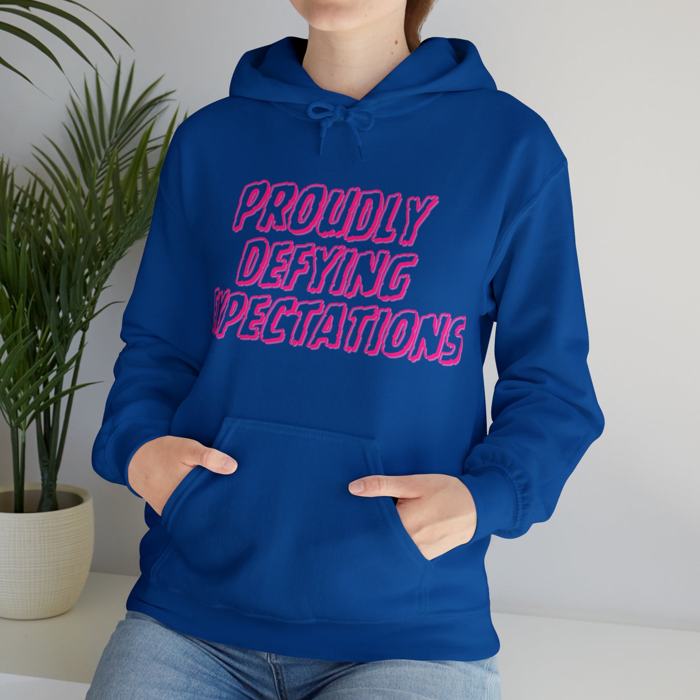 Unisex Hooded Sweatshirt - Proudly Defying Expectations