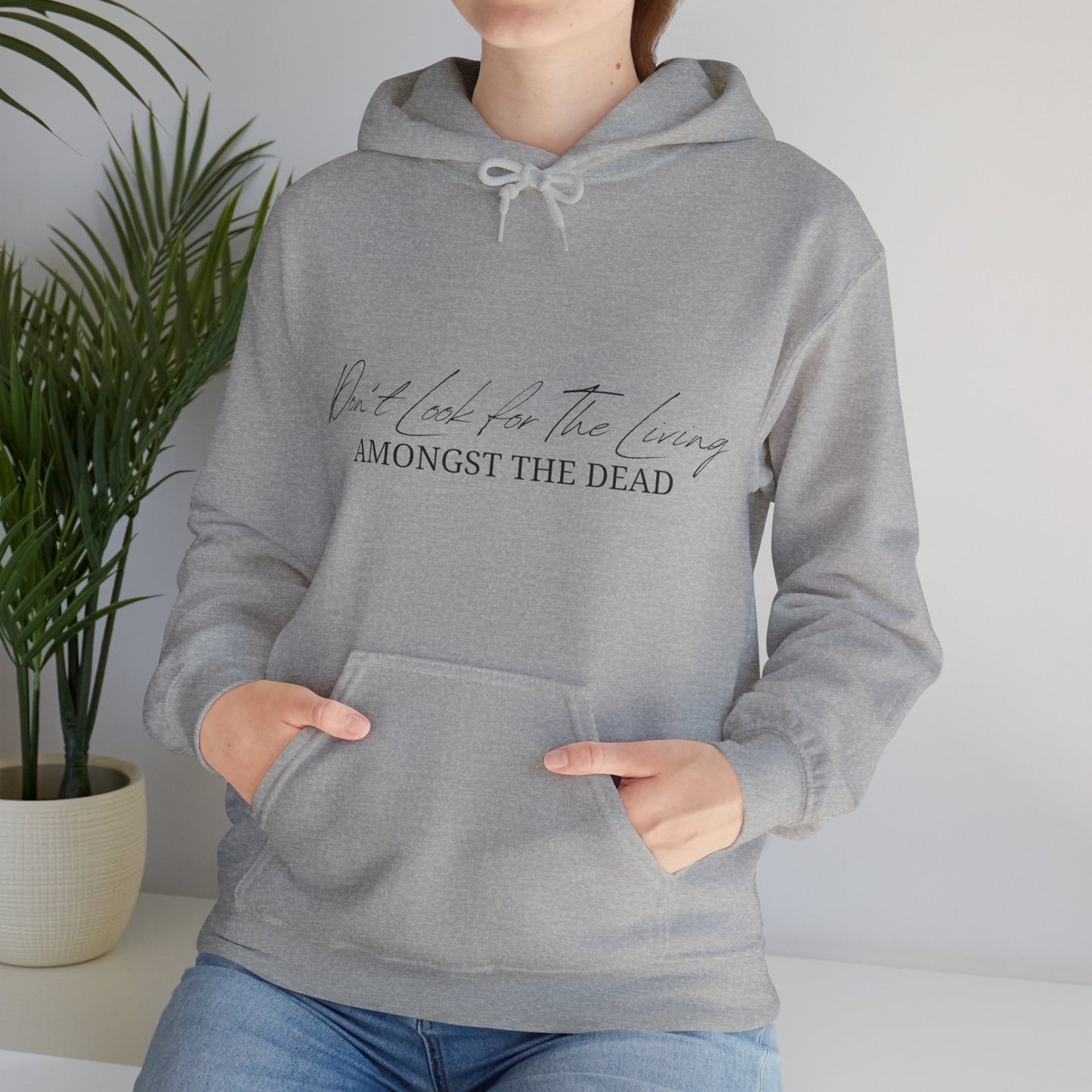 Unisex Hooded Sweatshirt - Don’t look for the living amongst the dead