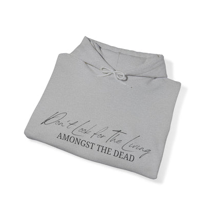 Unisex Hooded Sweatshirt - Don’t look for the living amongst the dead